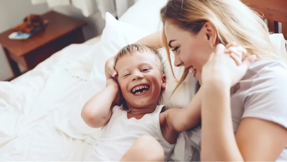 Mom with her son playing and laughing